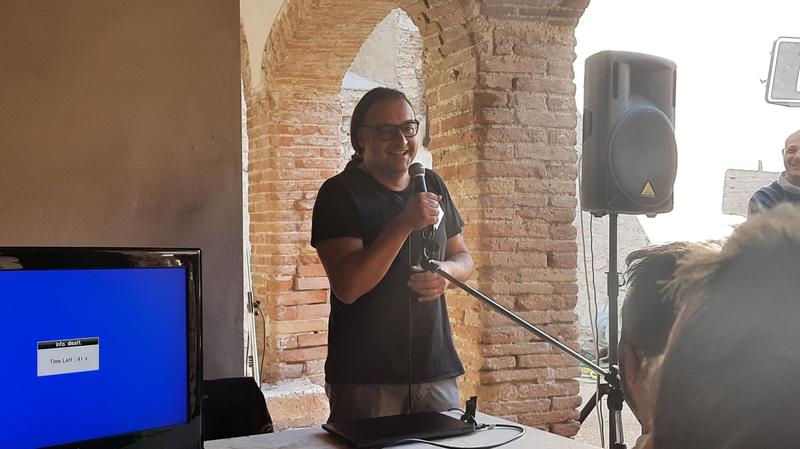 The speaker at the microphone