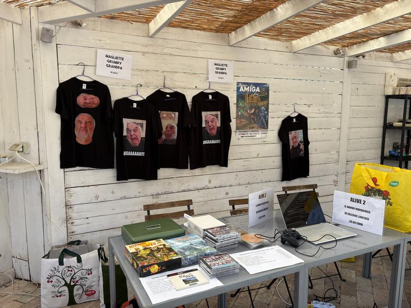 The stand with T-shirts and gadgets